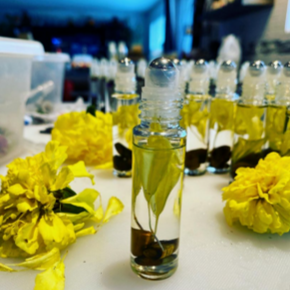 Solar Plexus Chakra roller ball with marigold and chamomile flowers, Golden Tiger's Eye crystal, enhances self-esteem, willpower, and confidence.