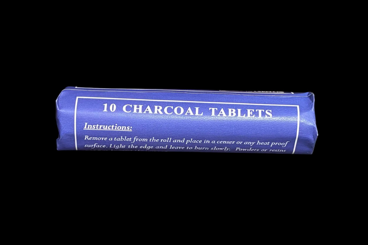 Roll of 10 charcoal tablets on a wooden surface
